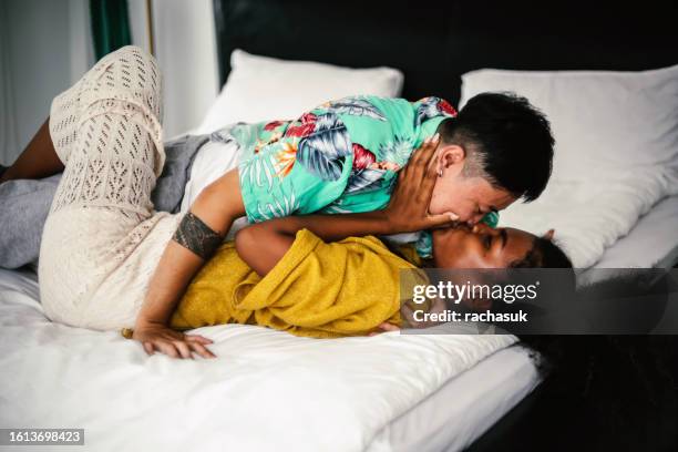 young lesbian couple love stay at home with feeling love - asian lesbians kiss stock pictures, royalty-free photos & images