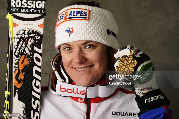 Marion Rolland of France celebrates with her gold medal after winning the Women's Downhill during the Alpine FIS Ski World Championships on February...