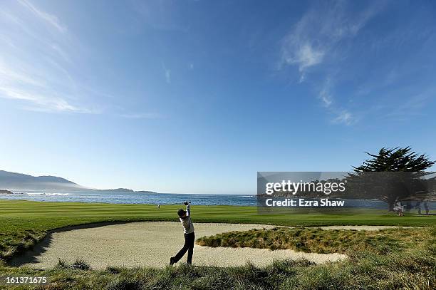 Ryuji Imada of Japan hits a shot on the 18th hole during the final round of the AT&T Pebble Beach National Pro-Am at Pebble Beach Golf Links on...