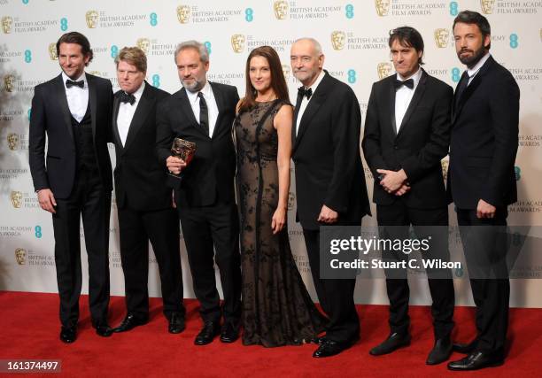 Ben Affleck and Bradley Miller pose with Robert Wade, Sam Mendes, Barbara Broccolli, Michael G Wilson and Neal Purvey after presenting them with the...