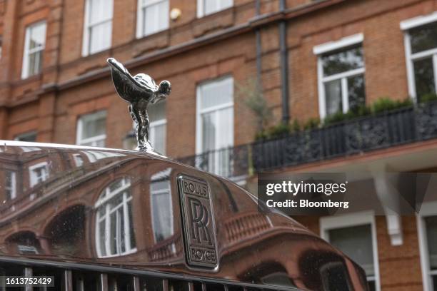 The grille of a Rolls Royce car reflects properties in the Kensington and Chelsea district of London, UK, on Monday, Aug. 21, 2023. Britain's...