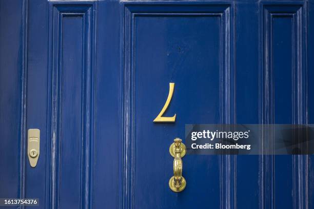 Door number 7 hangs upside down on the door of a private property in the Kensington and Chelsea district of London, UK, on Monday, Aug. 21, 2023....