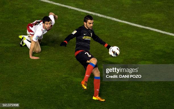 Atletico Madrid's forward Adrian Lopez Alvarez controls the ball during the Spanish league football match Rayo Vallecano vs Atletico de Madrid at the...