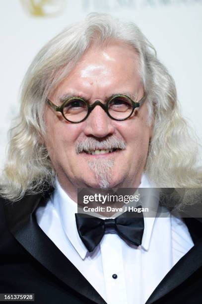 Billy Connolly poses in the press room at The EE British Academy Film Awards 2013 at The Royal Opera House on February 10, 2013 in London, England.