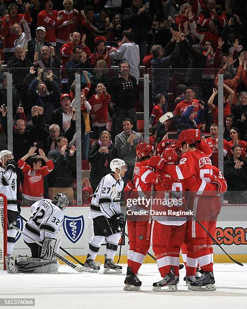 Jonathan Quick and Alec Martinez of the Los Angeles Kings can only watch as Daniel Cleary, Pavel Datsyuk and Ian White of the Detroit Red Wings...