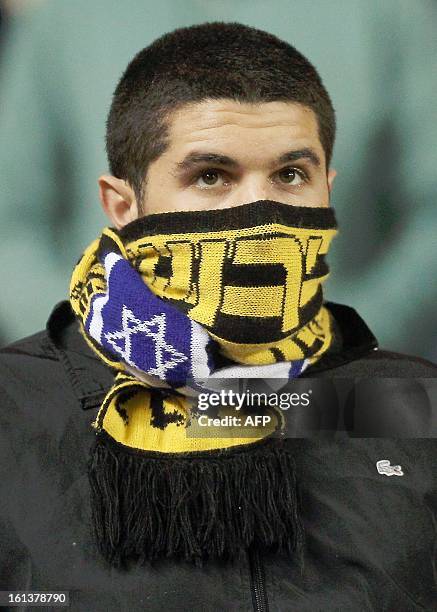 Beitar Jerusalem's supporter is attends an Israeli championship football match at the Teddy Kollek Stadium in Jerusalem on February 10, 2013. The...