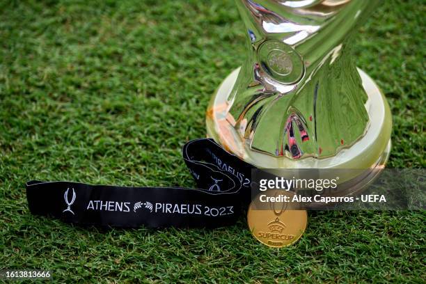View of a UEFA Super Cup winners' medal with the UEFA Super Cup trophy ahead of the UEFA Super Cup Final 2023 between Manchester City and Sevilla FC...