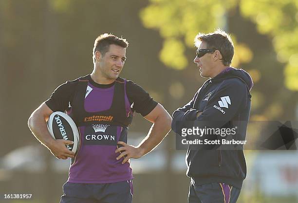 Cooper Cronk of the Storm talks with Storm coach Craig Bellamy during a Melbourne Storm NRL training session at Gosch's Paddock on February 11, 2013...