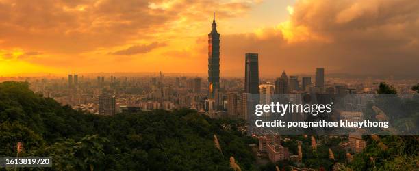 panorama dramatic urban cityscape of taipei with famous landmark, 101 skyscraper under amazing sunbeam light in sunset in taiwan - taiwan 101 stock pictures, royalty-free photos & images