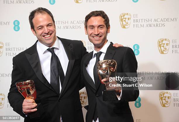 Simon Chinn and Malik Bendjelloul, winners of the Documentry award for "Searching For Sugar Man", pose in the press room at the EE British Academy...