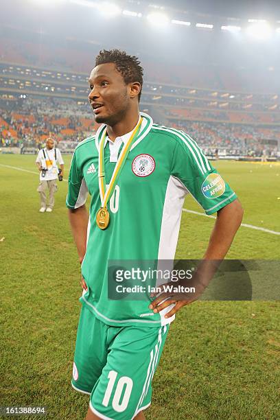 John Mikel Obi stands with a winners medal after winning the 2013 Africa Cup of Nations Final match between Nigeria and Burkina at FNB Stadium on...