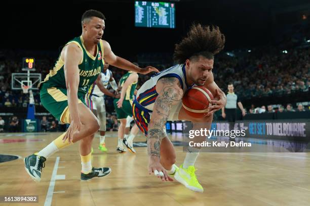 Michael Carrera of Venezuela dribbles the ball under pressure from Dante Exum of the Boomers during the match between Australia Boomers and Venezuela...