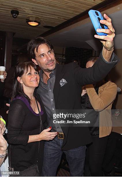 Actor Ricky Paull Goldin with a fan attend the "Spontaneous Construction" premiere at Guy?s American Kitchen & Bar on February 10, 2013 in New York...