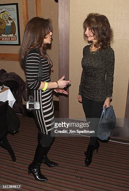 Actress Susan Lucci and a fan attend the "Spontaneous Construction" premiere at Guy?s American Kitchen & Bar on February 10, 2013 in New York City.