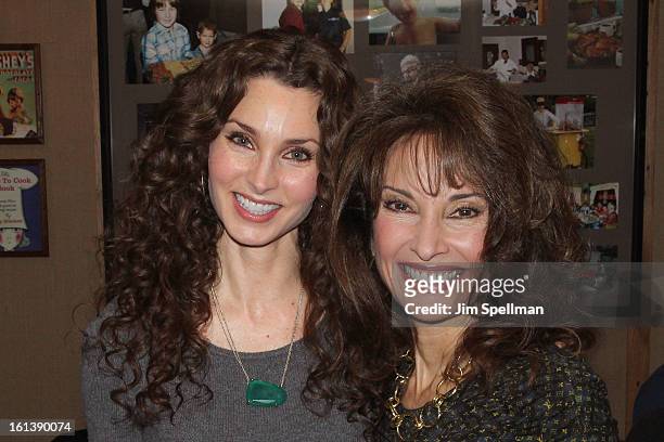 Actors Alicia Minshew and Susan Lucci attend the "Spontaneous Construction" premiere at Guy?s American Kitchen & Bar on February 10, 2013 in New York...