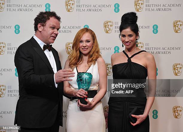 Actor and award presenter John C. Reilly and US actress Sarah Silverman pose with British actress Juno Temple after presenting her with the Rising...