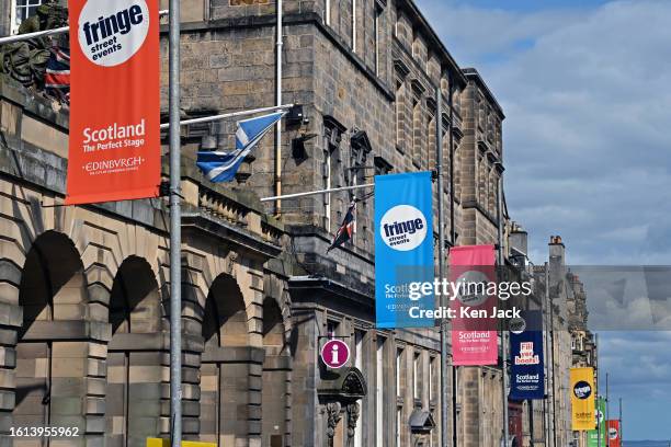 Banners promoting the Edinburgh Festival Fringe festoon the Royal Mile, as the arts extravaganza moves into its final week, on August 21, 2023 in...