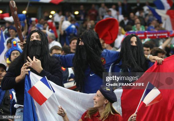 French supporters dressed as French lock Sebastien Chabal cheer their team during the rugby union World Cup group D match France vs. Ireland, 21...