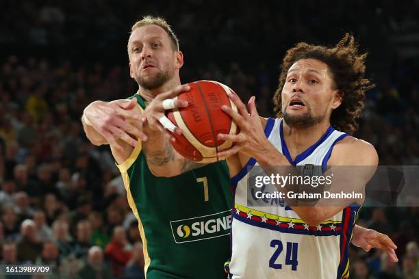 Joe Ingles of the Boomers and Michael Carrera of Venezuela compete for the ball during the match between Australia Boomers and Venezuela at Rod Laver...
