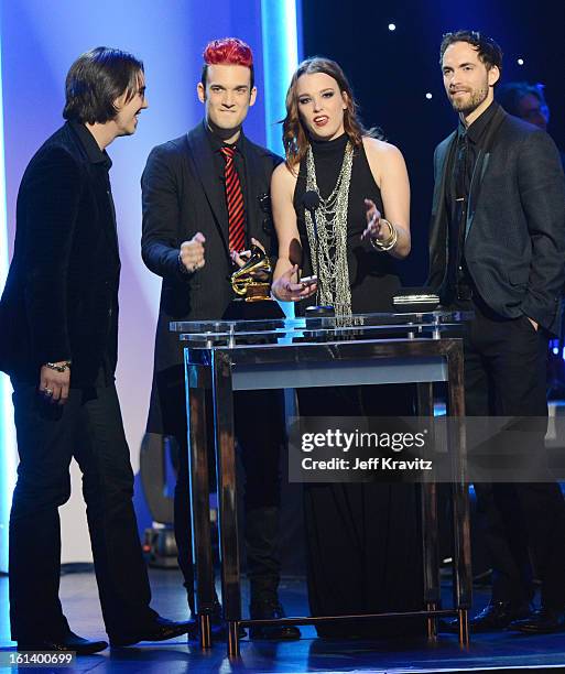 Musicians Joe Hottinger, Arejay Hale, Lzzy Hale, and Josh Smith of Halestorm accept an award onstage during the 55th Annual GRAMMY Awards at Nokia...