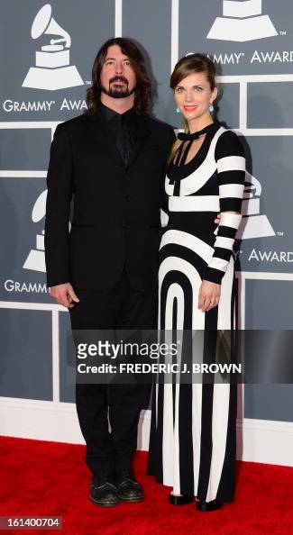 Dave Grohl and his wife Jordyn arrive on the red carpet at the... News ...