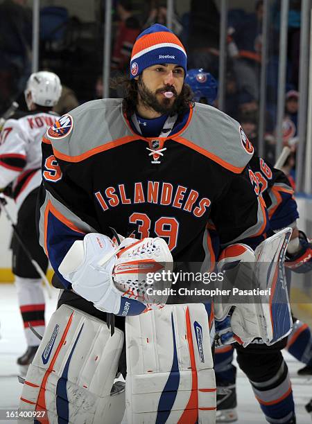 Rick DiPietro of the New York Islanders skates off the ice after the game against the New Jersey Devils on February 3, 2013 at Nassau Veterans...