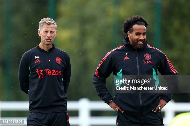 Manchester United U21s coachs Dave Hughes and Tom Huddlestone keep an eye on the warm up during the Premier League 2 match between Crystal Palace U21...