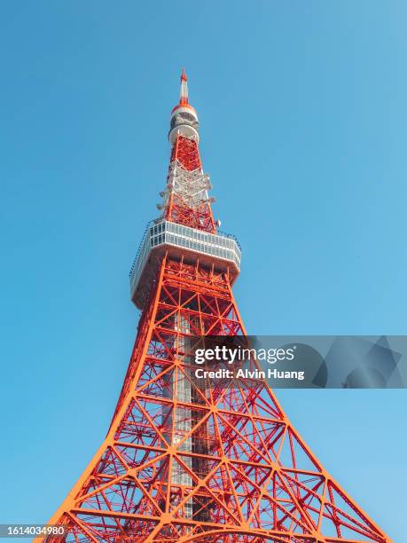 the famous tokyo tower with clear details and blue sky - roppongi stock pictures, royalty-free photos & images