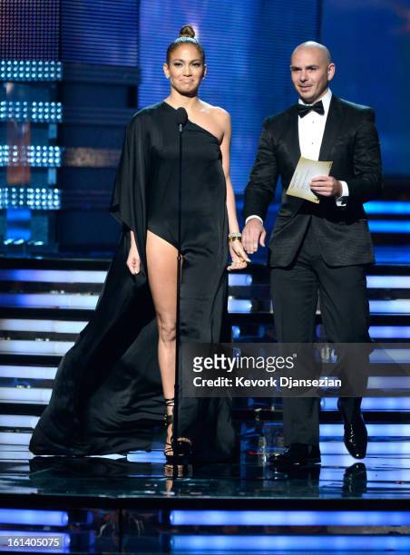 Singers Jennifer Lopez and Pitbull speak onstage at the 55th Annual GRAMMY Awards at Staples Center on February 10, 2013 in Los Angeles, California.