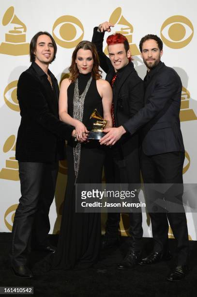 Musicians Joe Hottinger, Lzzy Hale, Arejay Hale and Josh Smith of the band Halestorm pose in the press room during the 55th Annual GRAMMY Awards at...