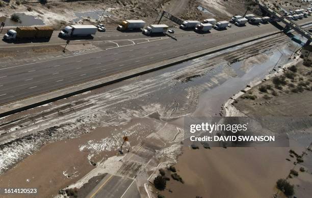 An aerial image shows traffic being diverted on Interstate 10 due to flooding and mud crossing the highway following heavy rains from Tropical Storm...