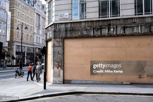 Closed down and boarded up retail space on the corner of Exeter Street and the Strand on 14th August 2023 in London, United Kingdom. Things have been...