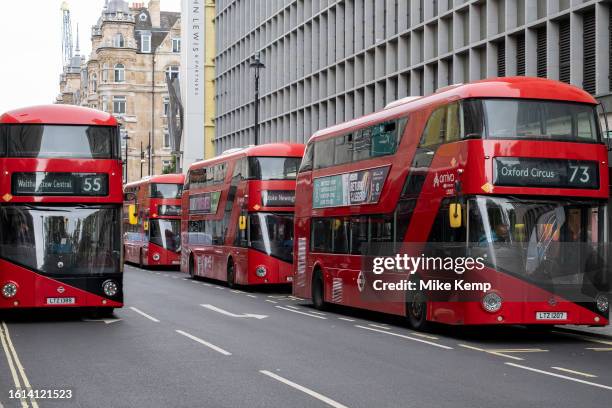 Red London New Routemaster buses parked in-line just off Oxford Street on 14th August 2023 in London, United Kingdom. The New Routemaster, originally...