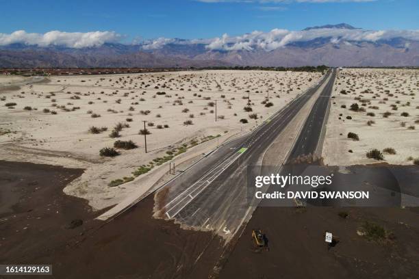 An aerial image shows no traffic on Interstate 10 due to flooding and mud crossing the highway following heavy rains from Tropical Storm Hilary, in...