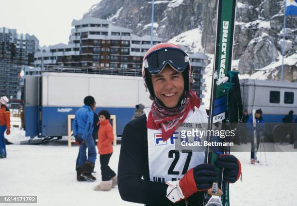 American skier Karl Anderson posing with his skis in Val d'Isere, France, where he is competing in the FIS Alpine Ski World Cup, December 1977.