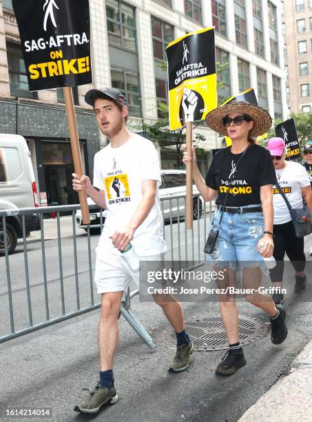 Roman Walker Zelman and Debra Messing are seen at the SAG-AFTRA picket line in Downtown, Manhattan on August 21, 2023 in New York City.