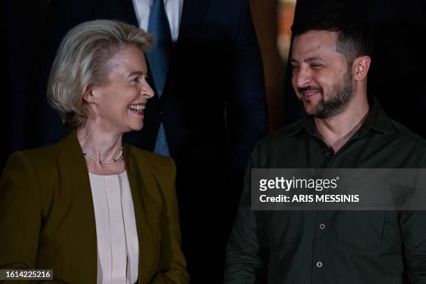 President of the European Commission Ursula von der Leyen speaks with Ukrainian President Volodymyr Zelenskyy during a family photo opportunity at...