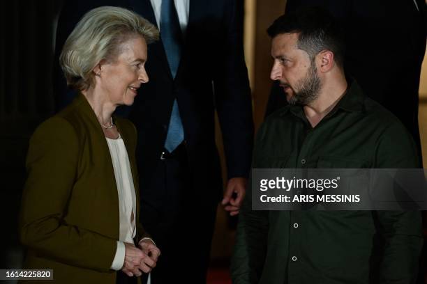 President of the European Commission Ursula von der Leyen speaks with Ukrainian President Volodymyr Zelenskyy during a family photo opportunity at...