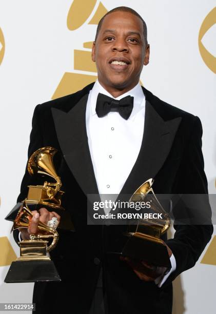 Rapper Jay-Z poses in the press room with his trophies at the Staples Center during the 55th Grammy Awards in Los Angeles, California, February 10,...