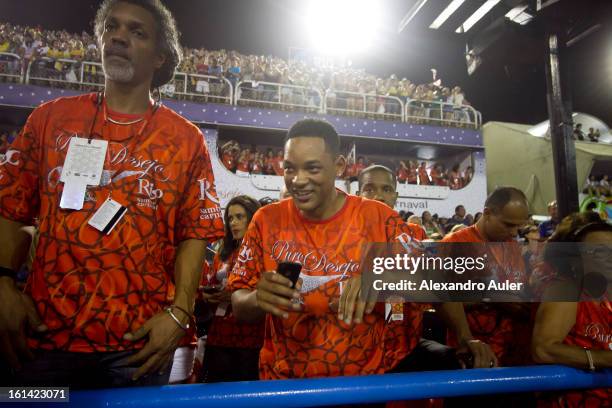 American actor Will Smith enjoys carnival as he watches Salgueiro Samba School perfomance as part of the 2013 Brazilian Carnival at Sapucaí Smbodrome...