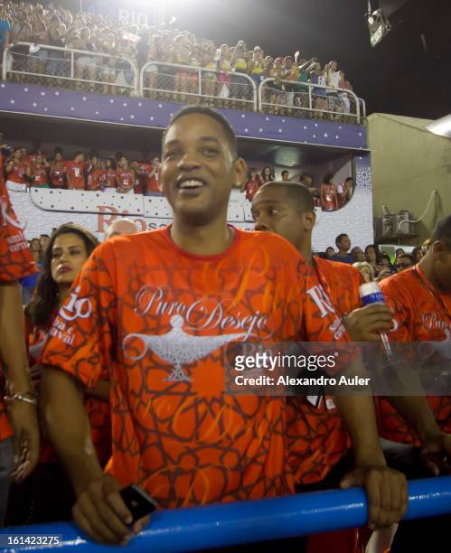 American actor Will Smith enjoys carnival as he watches Salgueiro Samba School perfomance as part of the 2013 Brazilian Carnival at Sapucaí Smbodrome...