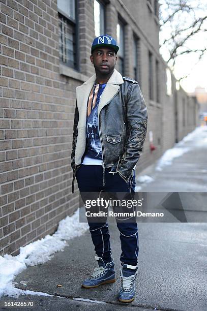 Akeem Fields seen outside the Y-3 show wearing Philip Lim jacket, Balenciaga shirt and Margiela shoes on February 10, 2013 in New York City.