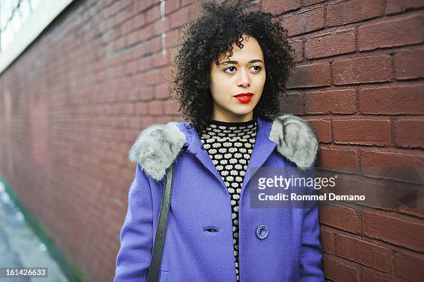 Megan Graham, Photographer, is seen outside the Y-3 show wearing J.Crew sweater and vintage jacket on February 10, 2013 in New York City.