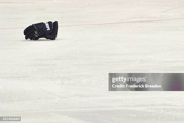 Glove lays on the ice during a fight between a Nashville Predators and an Los Angeles King at the Bridgestone Arena on February 7, 2013 in Nashville,...