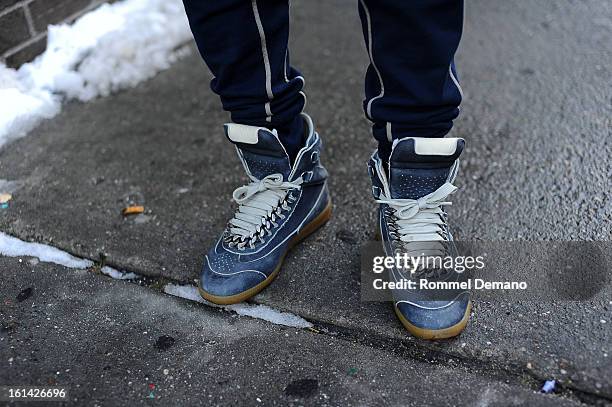 Akeem Fields seen outside the Y-3 show wearing a Margiela shoes on February 10, 2013 in New York City.