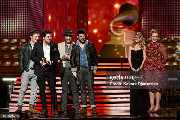 Musicians Ben Lovett, Marcus Mumford, Ted Dwane and Winston Marshall of Mumford & Sons accept Album of the Year award for "Babel" with presenter...