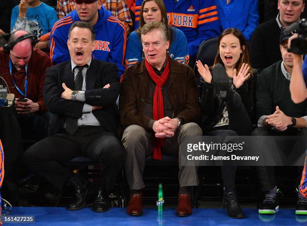 Tom Hanks, Christopher McDonald and Olivia Wilde attend the Los Angeles Clippers vs New York Knicks game at Madison Square Garden on February 10,...