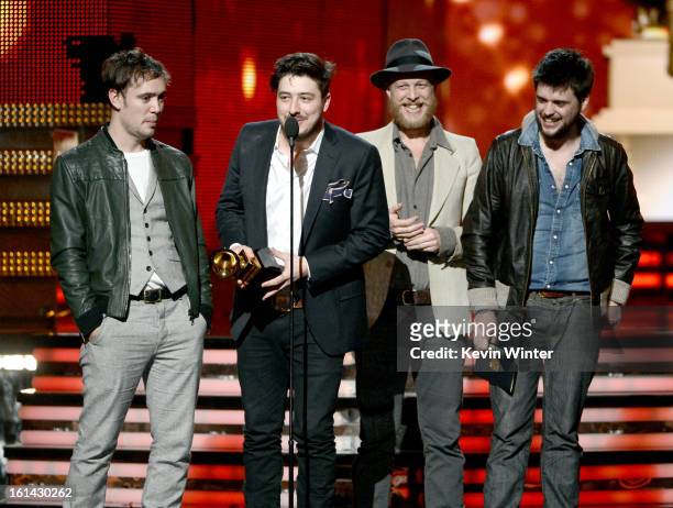 Musicians Ben Lovett, Marcus Mumford, Ted Dwane and Winston Marshall of Mumford & Sons accept Album of the Year award for 'Babel' onstage during the...
