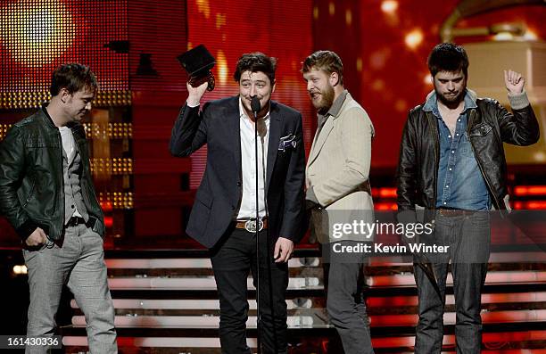 Musicians Ben Lovett, Marcus Mumford, Ted Dwane and Winston Marshall of Mumford & Sons accept Album of the Year award for 'Babel' onstage during the...