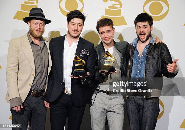 Musicians Ted Dwayne, Marcus Mumford, Ben Lovett and "Country" Winston Marshall of Mumford and Sons pose in the press room during the 55th Annual...